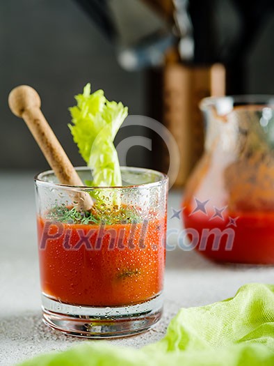 Tomato juice in glass with celery Tomato juice in glass with celery