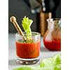 Tomato juice in glass with celery