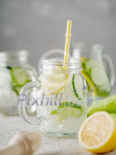 Detox diet. Fresh Summer Drink. Healthy detox fizzy lemonade with lemon and cucumber in mason jar. Healthy food concept. 