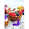 Dessert with sunflower seeds, yogurt and fresh berries on white wooden background