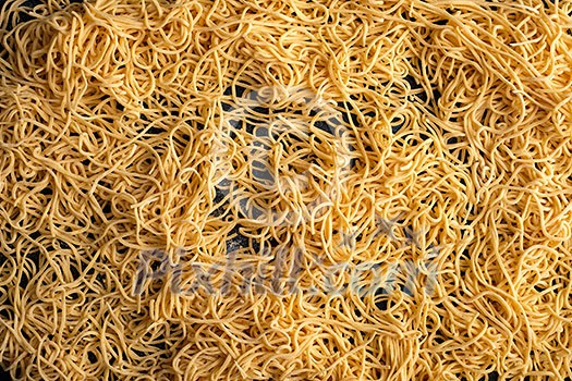 Dried egg noodles. Raw Fresh Spaghetti. Food background. Dried egg noodles. Raw Fresh Spaghetti. Food background.
