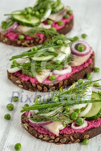 Sandwich with herring, horseradish and fresh herbs