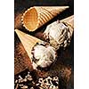 Creamy ice cream with chocolate chips in a waffle cone.