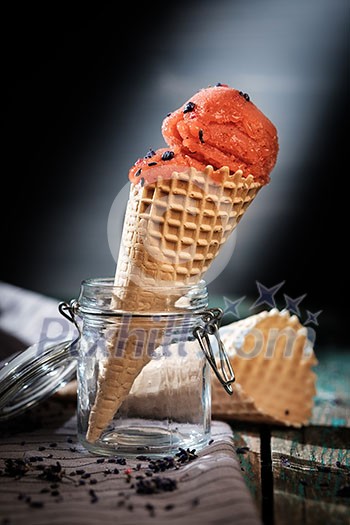 Sorbet in waffle cones on a wooden table