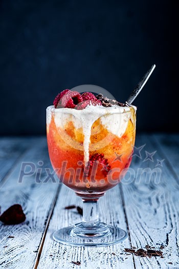 Cold dessert with ice cream on a wooden table.