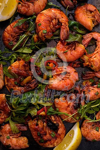 Large grilled BBQ shrimp with sweet chili sauce, green onion and lemon Large grilled BBQ shrimp with sweet chili sauce, green onion and lemon