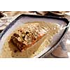 Salmon with cream sauce and nuts