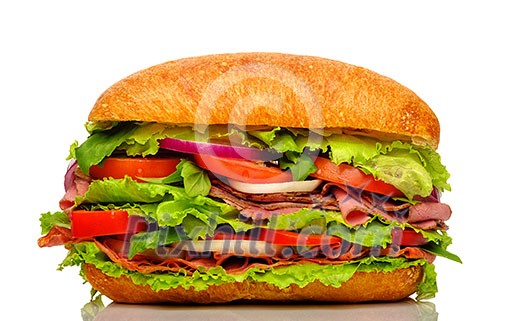 Big fresh sandwich with meat and vegetables isolated on white background