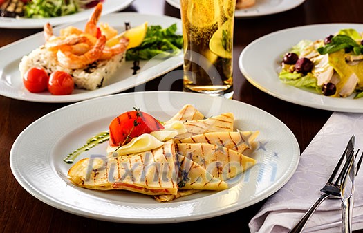 Served table in the restaurant. Pancakes with salmon Served table in the restaurant. Pancakes with salmon