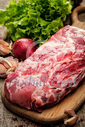 Raw pork neck with fresh vegetables