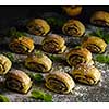 Puff pastry with chocolate on a dark table. Country style.