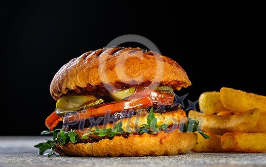 Fresh juicy delicious homemade burger. Hamburger with meat and fresh herbs. Fresh juicy delicious homemade burger. Hamburger with meat and fresh herbs.