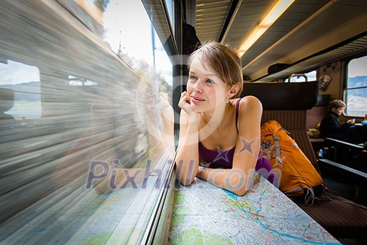 Young woman traveling by train