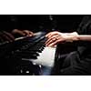 Close up of hands of a female piano player