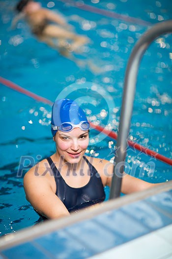 Female swimmer in an indoor swimming pool Female swimmer in an indoor swimming pool