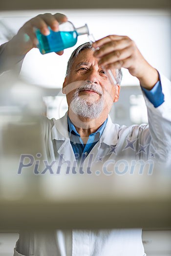 Senior male researcher carrying out scientific research in a lab (shallow DOF; color toned image) Senior male researcher carrying out scientific research in a lab (shallow DOF; color toned image)
