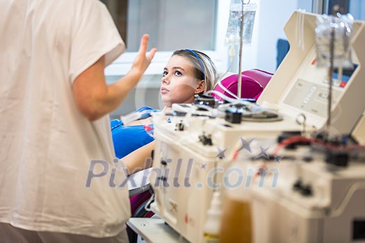 Young woman giving blood in a modern hospital Young woman giving blood in a modern hospital