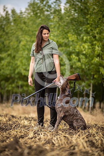 Autumn hunting season. Hunting. Outdoor sports. Woman hunter in the woods Autumn hunting season. Hunting. Outdoor sports. Woman hunter in the woods