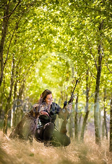 Autumn hunting season. Hunting. Outdoor sports. Woman hunter in the woods Autumn hunting season. Hunting. Outdoor sports. Woman hunter in the woods