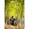 Autumn hunting season. Hunting. Outdoor sports. Woman hunter in the woods