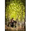 Autumn hunting season. Hunting. Outdoor sports. Woman hunter in the woods