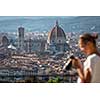Splendid Florence, Italy, with out of focus female photographer in the foreground