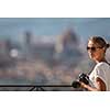 Splendid Florence, Italy, with out of focus female photographer in the foreground