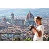 Splendid Florence, Italy, with out of focus female photographer in the foreground