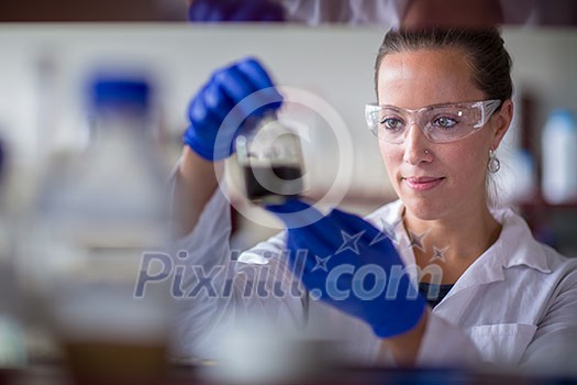 Female researcher carrying out scientific research in a lab (shallow DOF; color toned image) Female researcher carrying out scientific research in a lab (shallow DOF; color toned image)