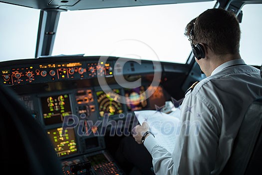 Pilot's hand accelerating on the throttle in  a commercial airliner airplane flight cockpit during takeoff