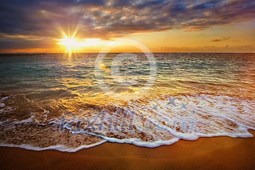 Beach holidays vacation background - calm ocean during tropical sunrise Beach holidays vacation background - calm ocean during tropical sunrise
