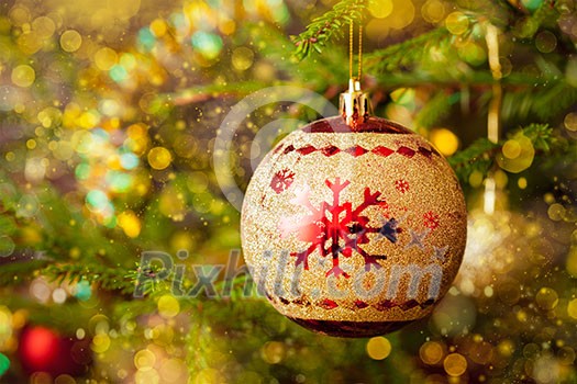 Christmas celebration holiday background - christmas-tree decoration bauble on decorated Christmas tree with defocused blurred lights bokeh and copyspalce