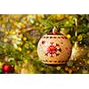 Christmas celebration holiday background - christmas-tree decoration bauble on decorated Christmas tree with defocused blurred lights bokeh and copyspalce