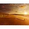 White sand dunes on sunrise, Mui Ne, Vietnam. With lens flare and light leak