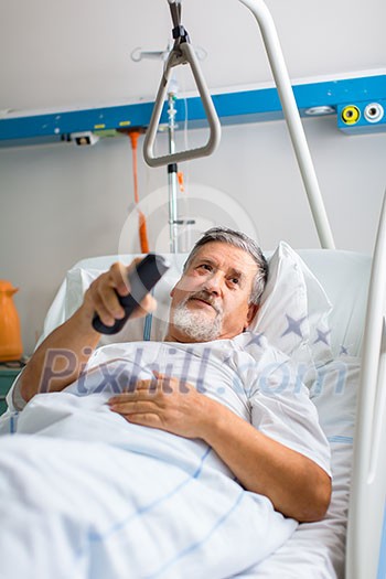 Senior male patient in a modern hospital (shallow DOF; color toned image) Senior male patient in a modern hospital (shallow DOF; color toned image)
