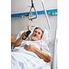 Senior male patient in a modern hospital (shallow DOF; color toned image)