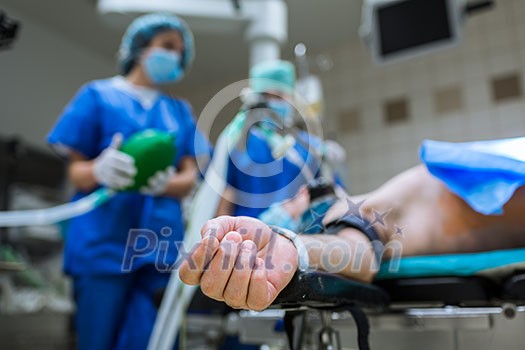 Unidentified patient undergoing a surgery (no faces, shallow DOF) Unidentified patient undergoing a surgery (no faces, shallow DOF)