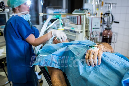 Unidentified boy undergoing a surgery. Focus on the monitor with vital functions Unidentified boy undergoing a surgery. Focus on the monitor with vital functions
