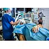 Unidentified boy undergoing a surgery. Focus on the monitor with vital functions