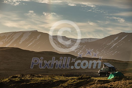 Highlands of Scotland - someone found a lovely spot for tonight - camper and a tent in a splendid landscape Highlands of Scotland - someone found a lovely spot for tonight - camper and a tent in a splendid landscape