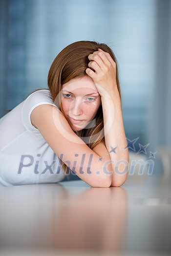 Depressed/anxious young woman (shallow DOF; color toned image)