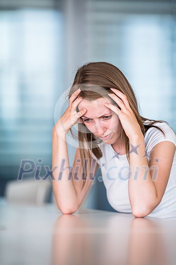 Depressed/anxious young woman (shallow DOF; color toned image) Depressed/anxious young woman (shallow DOF; color toned image)