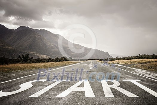 Conceptual image with word start on asphalt road