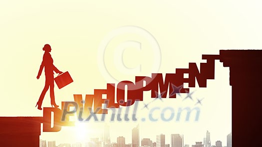 Businesswoman running on development word bridge over precipice Businesswoman running on development word bridge over precipice
