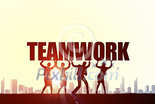 Business people lifting word teamwork representing collaboration concept