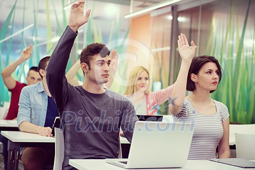 teacher teaching lessons, smart students group raise hands up in school  classroom