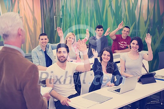 group of students study with professor in modern school classroom group of students study with professor in modern school classroom