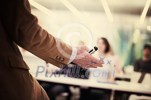 close up of teacher hand with marker while teaching lessons in school  classroom to students