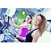 group of young people running on treadmills in modern sport  gym