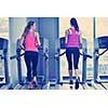 group of young people running on treadmills in modern sport  gym